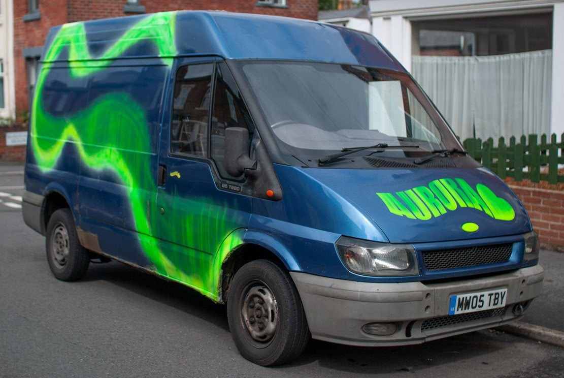 3-aurora-van a blue ford transit van called Aurora with an Aurora wavy logo on the front bonet