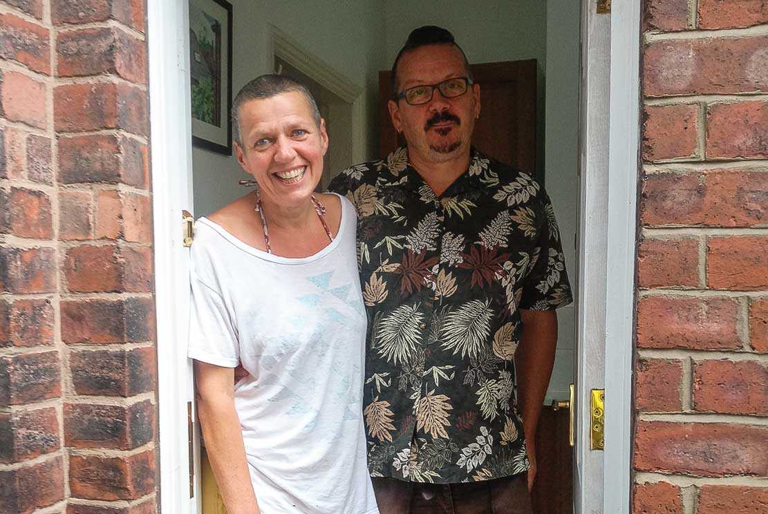 Helen and Steve, standing in their door way saying farewell