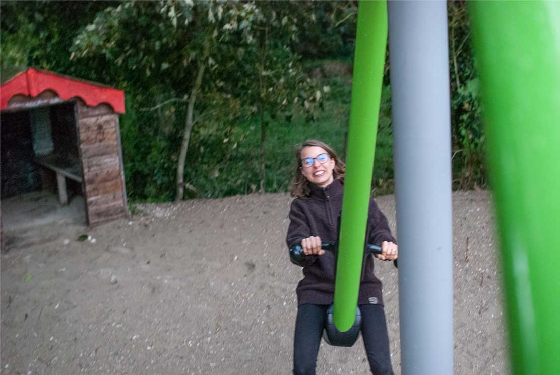 2 Meline laughing on a huge seesaw while me taking photo from the other side